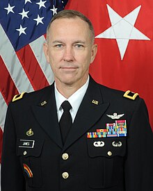 2022 color head and shoulders photo of Brigadier General Jack A. James in Army dress blue uniform, facing front