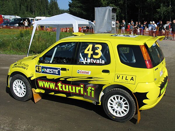 Jari-Matti Latvala driving his Suzuki Ignis S1600 at the 2004 Rally Finland