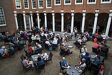 People sitting at tables at the Jongensbinnenplaats (lit. 'Boys' Courtyard') in the Amsterdam Museum in Amsterdam, the Netherlands Jongensbinnenplaats nu.jpg