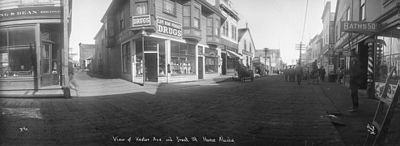 Kester Ave and Front St Nome, Alaska 1898-1908. Planks are seen on the street