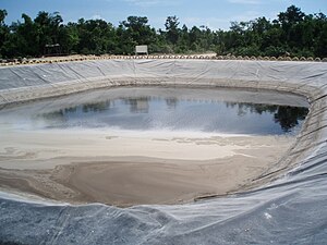 A leachate evaporation pond in a landfill site located in Cancun, Mexico Leachate Pond.JPG