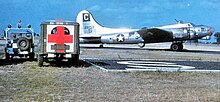 Group B-17F with crash crew Lockheed-Vega B-17F-50-VE Fortress 1945.jpg