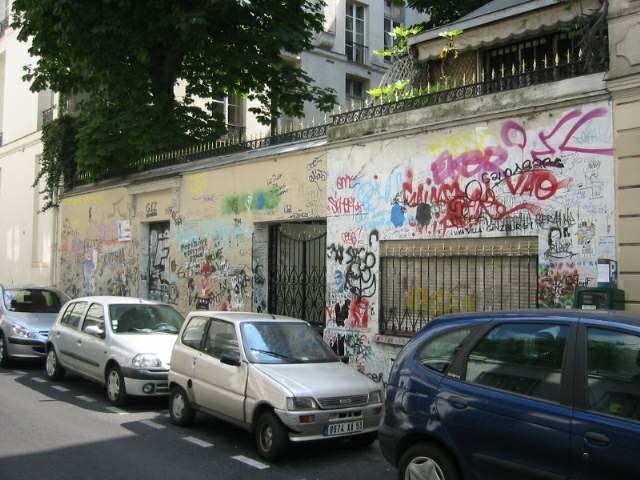 Tribute graffiti covers the outer wall of Serge Gainsbourg's house on the rue de Verneuil in Paris, looked after by Charlotte Gainsbourg after her fat
