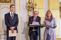 Committee chair Anders Olsson explaining Annie Ernaux's qualities of being the 2022 Nobel laureate with Committee member Ellen Mattson and Permanent Secretary Mats Malm. Mats Malm, Anders Olsson, Ellen Mattson on the Nobel Prize in Literature 2022 04.jpg