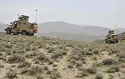 Mine-resistant, ambush-protected vehicles assigned to the Albanian special operations forces provide security for coalition forces at an Afghan Border Police checkpoint near the Afghanistan-Pakistan border 130401-A-MX357-044