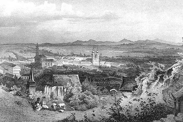 Historical picture of the city. View from the Avas hill with the Gothic church in the foreground. The church with two towers is the Minorite Church on