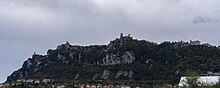 Monte Titano and the three fortresses on top of it can be seen from many kilometers away Monte Titano Panorama.jpg