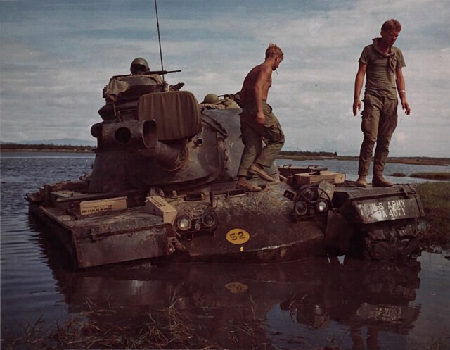 An M48 tank of "A" Troop, 1st Squadron, 1st Cavalry, is stuck in mud and water during an operation 15 km northeast of Hill 29, 2 August 1968