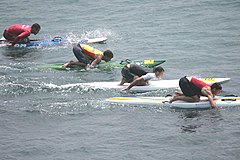 Hand paddling surfboards