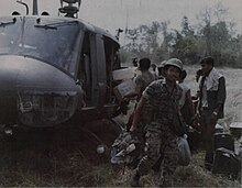 Royal Thai Army troops in the field south of Bearcat unload supplies from a UH-1D helicopter from the 240th Helicopter Assault Company, 23 January 1971 Panther supply unload, January 1971.jpg