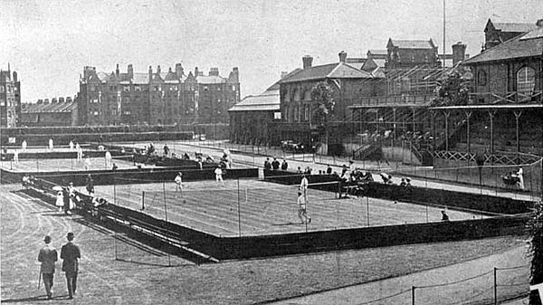 Three grass courts in front of the pavilion at the Queen's Club