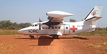 The majority of airfields in the Central African Republic have unpaved runways and are only used by chartered flights such as this one from the Red Cross. Reaching those in need (11237183866).jpg