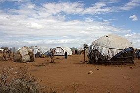 Refugee shelters in the Dadaab camp, northern Kenya, July 2011 (5961213058).jpg