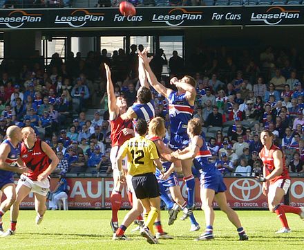 Ball being contested during an AFL game