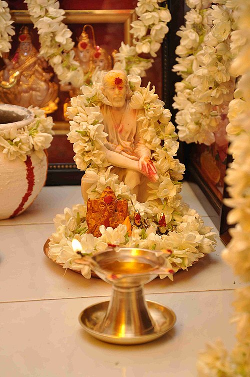 A marble statue of Sai Baba.