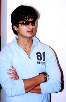 Shahid Kapoor, wearing sunglasses, looks away from the camera