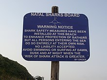 A sign warning about the presence of sharks in Salt Rock, South Africa Shark warning - Salt Rock South Africa.jpg
