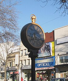 Looking northeast at 30-78 Steinway Street clock Steinway St clock jeh.JPG