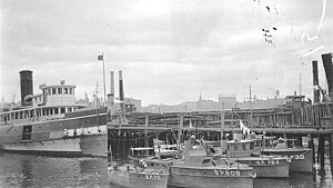 From left to right starting at bottom center of photograph, the U.S. Navy patrol vessels USS Kiowa (SP-711), USS Skink (SP-605), USS Whistler (SP-784), and USS Lynx II (SP-730) at Lockwood's Basin in Boston, Massachusetts, ca. 1918. The passenger and cargo ship USS Moosehead (ID-2047) is at left. USS Kiowa (SP-711), USS Skink (SP-605), USS Whistler (SP-784), and USS Lynx II (SP-730).jpg