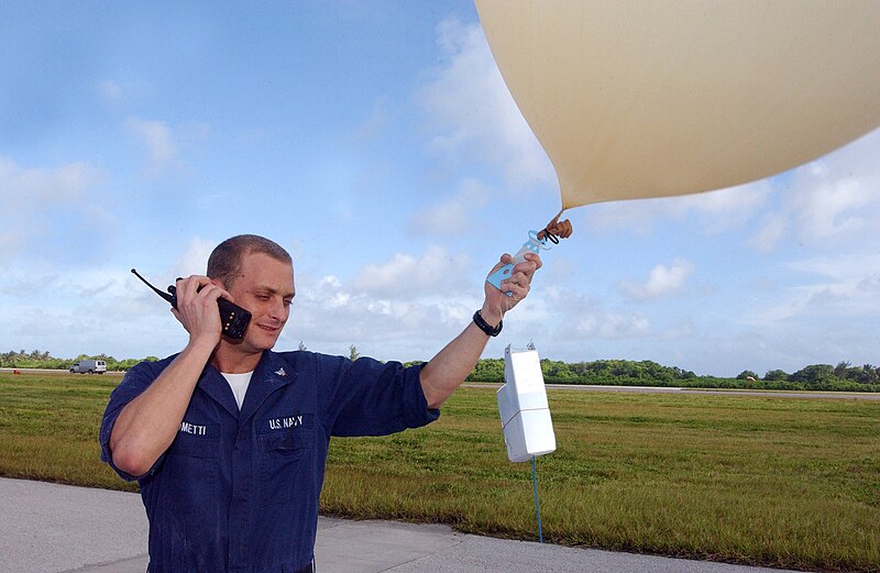 File:US Navy 050621-F-1342R-020 U.S. Navy Aerographer's Mate 3rd Class Antoine Giacometti contacts the air traffic control tower for clearance to release a weather balloon at a forward operating location in the British Indian Ocean.jpg