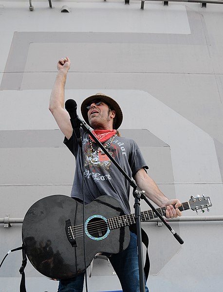 File:US Navy 100303-N-8655E-702 Big Kenny, a member of the country music duo Big and Rich, performs on the flight deck of the multipurpose amphibious assault ship USS Bataan (LHD 5).jpg