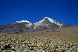 Uturunku is a cone in a desolate landscape, with an adjacent smaller non-conical mountain.