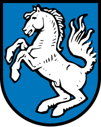 Gemeinde Burgkirchen In Blau ein silbernes, springendes Roß.