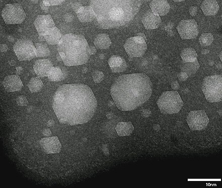 Liquid (featureless) and crystalline solid Xe nanoparticles produced by implanting Xe+ ions into aluminium at room temperature.