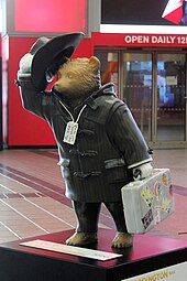 Mason's Paddington Bear statue--themed "Wish You Were Here"--outside the O2 Arena in London, auctioned to raise funds for the NSPCC "Wish You Were Here" Paddington Bear, The O2 - geograph.org.uk - 4261944.jpg