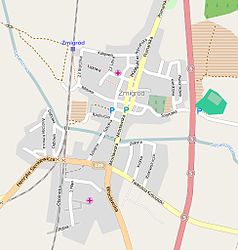 Mapa konturowa Żmigrodu, blisko centrum u góry znajduje się punkt z opisem „Kościół św. Stanisława Kostki”