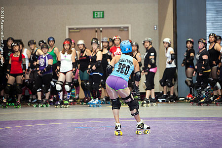 "Isabelle Ringer" of the San Diego Derby Dolls displays her derby name while coaching a group of skaters. 2011-07-31 Rollercon (Classes)-1000.jpg