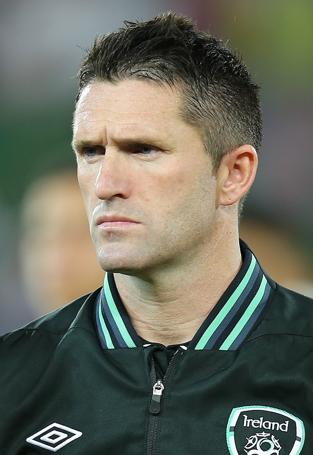A headshot of a footballer with short dark hair.