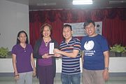 Michael Ong with other Wikimedians handing over a plaque of appreciation to Prof. Joycie Alegre during the 6th Waray Wikipedia Edit-a-thon at the University of the Philippines Visayas Tacloban College (UPVTC) held on November 18-19, 2016. The event was organized by the The Leyte-Samar Heritage Center of UPVTC and the Sinirangan Bisaya Wikimedia Community.