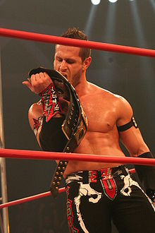 Shelley is a three-time TNA/Impact World Tag Team Champion with Chris Sabin. Alex Shelley TNA Tag Champion.jpg