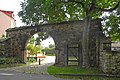 Wall with archway and gate