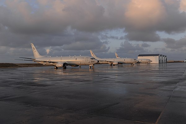 Three US Navy P-8A Poseidon maritime patrol aircraft parked on the apron of NAS Keflavik during November 2019