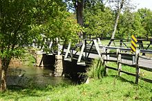 Truss bridge on Mill Road, Whitehouse, New Jersey over the Rockaway Creek, listed in the Whitehouse-Mechanicsville Historic District. Bridge at Rockaway Creek, Whitehouse, NJ.jpg