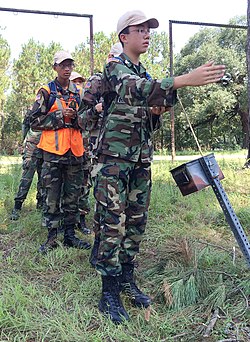 Cadet Airmen First Class Blake Jones, Echo Flight, Squadron 2, Georgia Wing Civil Air Patrol, points his team in the direction to find their next objective during land navigation training, July 22. Cadet Airman First Class Blake Jones, Echo Flight, Squadron 2, Georgia Wing Civil Air Patrol.JPG