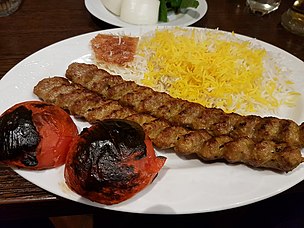 Kabab with saffron rice and grilled tomatoes