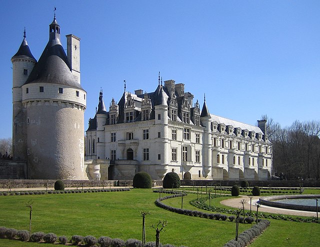 View of the château from the edge of the formal gardens to the west of the residence. The medieval keep to the left is the last vestige of the previou