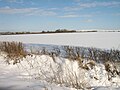 Snow cleanly covering a field.