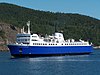 The Camille-Marcoux, the Godbout—Matane ferry, pictured against a wooded hillside