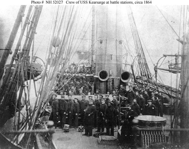 Crew of USS Kearsarge in 1864 after the battle; showing both 11-inch guns pointed to starboard as they were during the battle