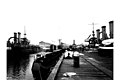 Drydock, Puget Sound Naval Shipyard, Bremerton, showing battleships WISCONSIN (left), NEBRASKA (right), and U S revenue cutter (CURTIS 771).jpeg