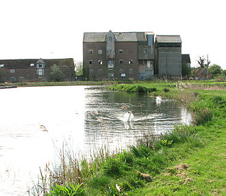 Ebridge mill in 2014, before its conversion into housing, with the restored mill pond in the foreground Ebridge Mill - geograph.org.uk - 3929307.jpg