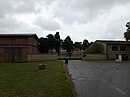 Manor house with farm yard, consisting of a greenhouse, residential building, farm building, park and garden center