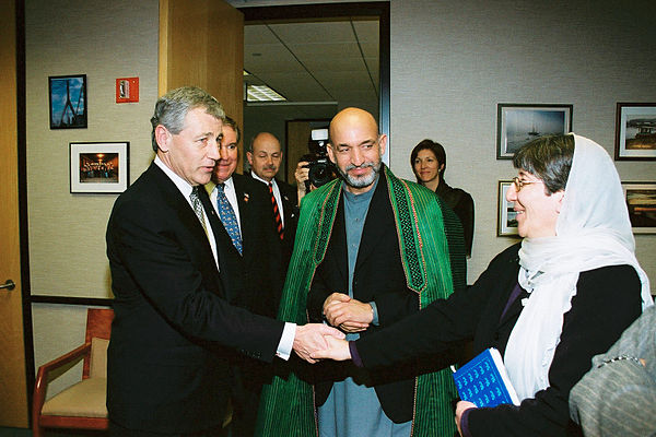 Hagel in a 2002 visit with Afghan President Hamid Karzai, and Afghan Minister of Women's Affairs Sima Samar