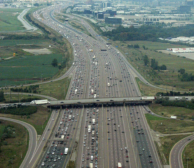 An aerial image of an 18-lane freeway. The freeway is divided into four separate set of lanes, known as carriageways.