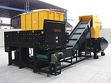 Industrial shredder. This shredder is set up in line with a granulator, in order to reduce the size of the processed material more. Industrialshredder.jpg