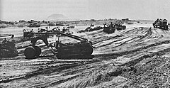 Fierce combat continued as Airfield No. 1 was scraped and graded. Iwo Jima Airfield Number 1.jpg